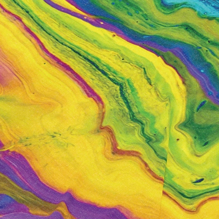 Colorful tie-dye patterned fabric with fringe on a white background